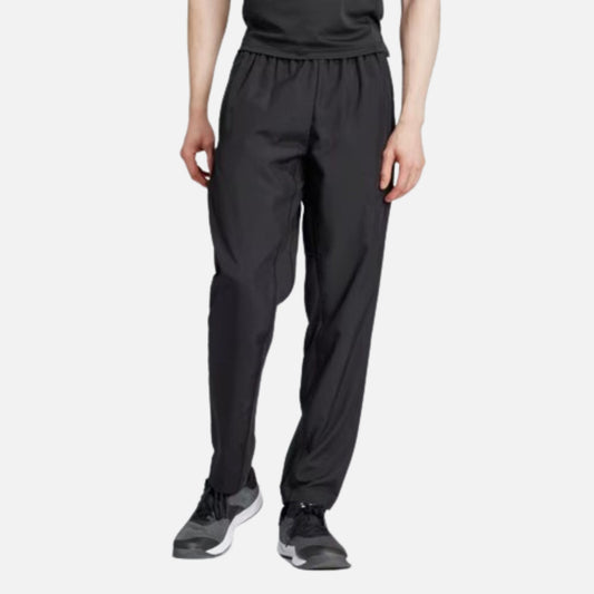 TRAIN ESSENTIALS SEASONAL WOVEN TRAINING PANTS